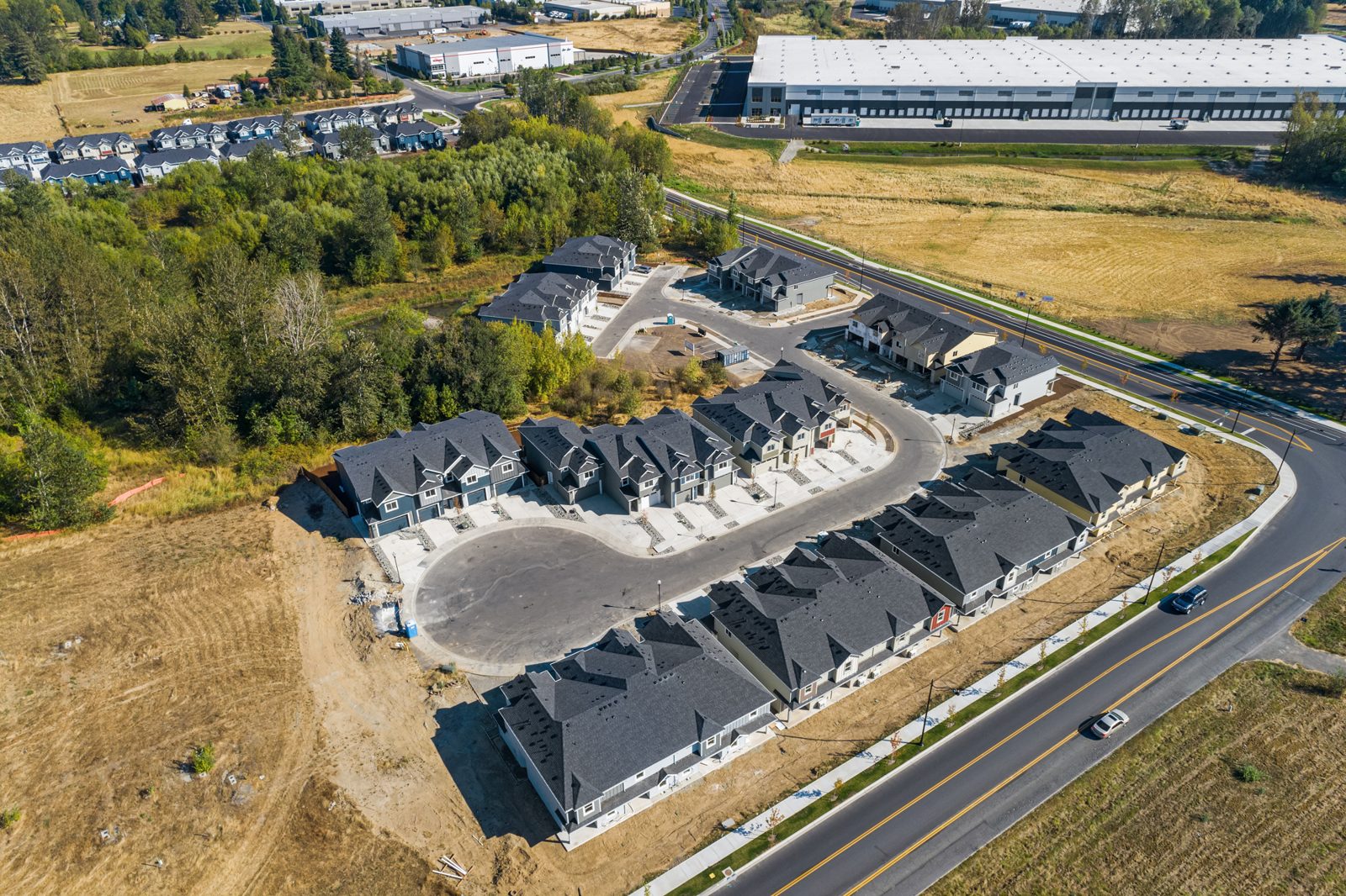 Aerial view of The Crossing townhome buildings and new streets in Ridgefield