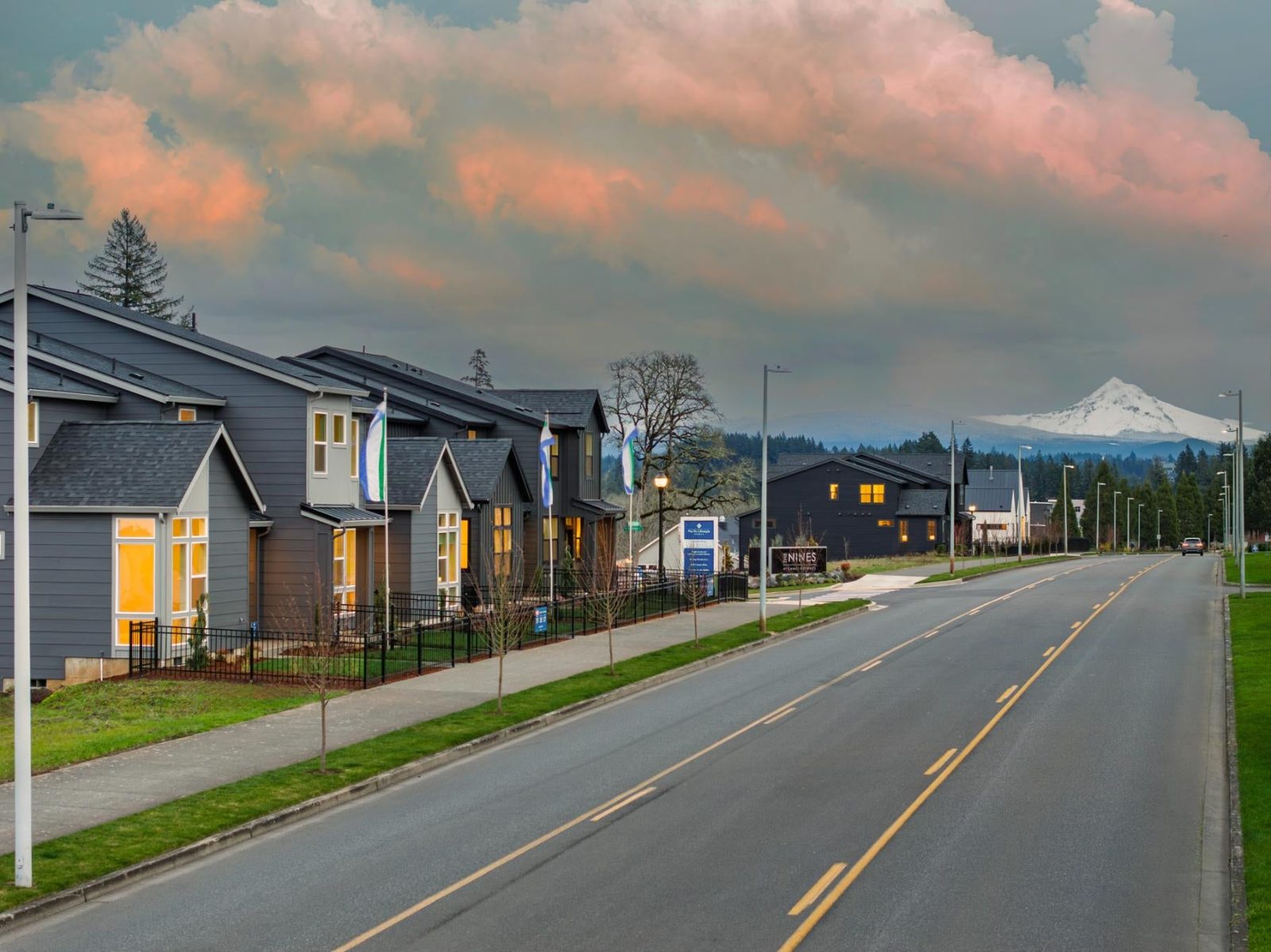 Finished townhomes along NW Camas Meadows Drive at The Nines with Mount Hood in the distance