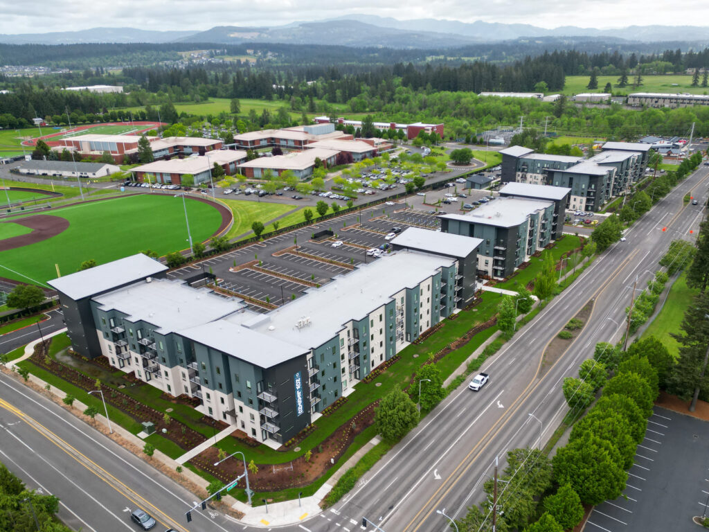 Aerial view of The Oliveen apartment buildings beside Union High School ball fields in Camas