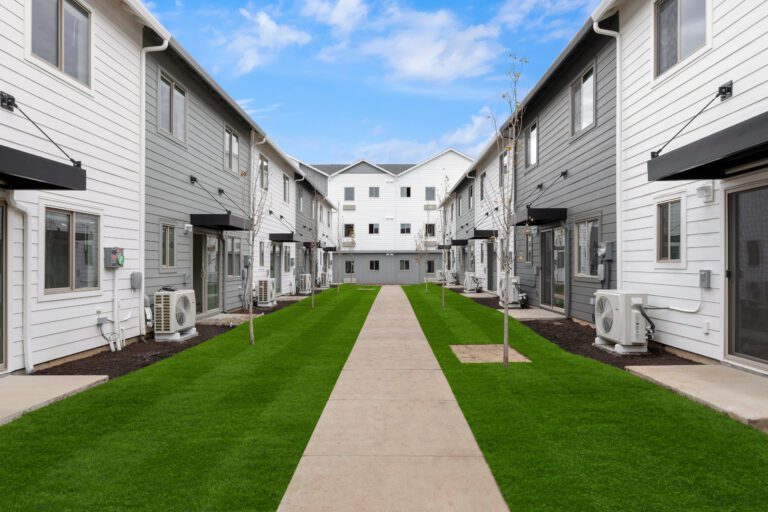Landscaped walkway between Terra Lofts townhomes